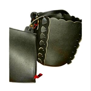 Black leather bucket bag with pouch insert.